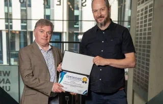 JJ-Quinlan-receiving-his-reward-from-Barry-McAdam-UCD-Innovation-Academy-Manager-2.jpg