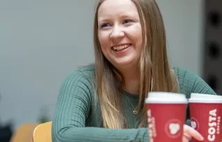 Student with Costa Coffee Cup