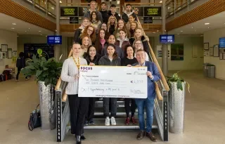 Digital Marketing Students making a donation to Focus Ireland