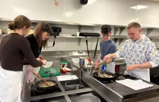 Culinary Arts students preparing a sustainable meal during the workshop