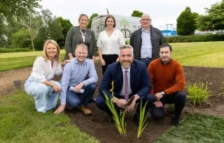 Opening the conference, Minister Christopher O’Sullivan planted an iris in DkIT’s raingarden.
