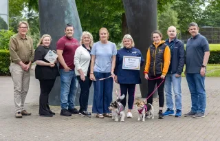 The team involved in the 'Recycle for Rescue' initiative pictured with rescue dogs Stewie and Missy