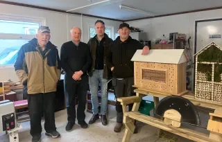 Ben McCabe, pictured with members of the Carrickmacross Men's Shed Pearse Callan, Frank Ward, and Hugh Crawley