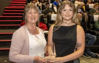 Wendy Baugh (Blackmagic Design) presenting a DkIT award to Jessica Doherty