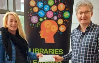 Wendy Rudd receiving her award from Peter Mac Kenna, Subject Librarian, DkIT School of Health
