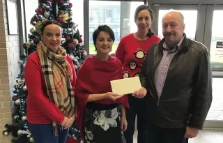 Pictured left to right: Ms. Bernie O'Hara, DkIT Chaplain; Dr. Bernadette Brereton of the DkIT WELCOME College of Sanctuary team; Dr. Annaleigh Margey, DkIT History Lecturer; presenting our donation to Mr. Robbie Hyslop, Manager of Carroll Village, Louth