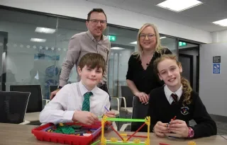 (Front) Aaron from Bangor Central Integrated Primary School and Victoria from Bloomfield Primary School test out the new All-Island Engineering resources developed by Engineering Lecturers (back) Gareth Kelly from Dundalk Institute of Technology (DkIT) and Aine McGreeghan South Eastern Regional College (SERC) and funded through The Community Foundation Ireland.