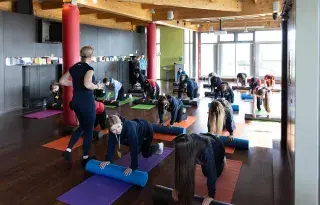 Students taking part in Pilates during the Ex-HER-cise event