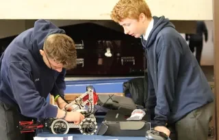 Dominik Bayer and Cillian Watterson from Dundalk Grammar School making some final touches to their robot. 
