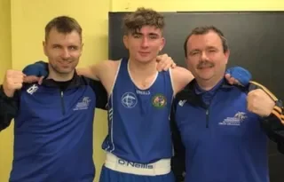 Chris O’Neill (centre) pictured with Ruairi O’Murchu (left) and his grandfather Jim O’Neill (right)