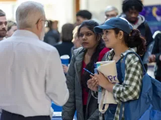 Students discussing career opportunities at the Business and Humanities Careers Fair