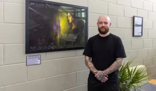 Artist Ne O Nuallain with his painting "An Dochas Amach is an Aontas Isteach"