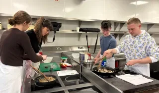 Culinary Arts students preparing a sustainable meal during the workshop