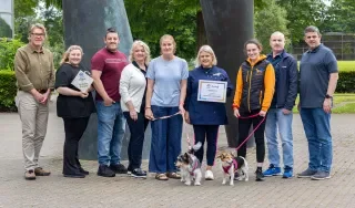 The team involved in the 'Recycle for Rescue' initiative pictured with rescue dogs Stewie and Missy