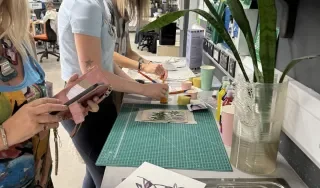 Print work during the Immerse Her Bootcamp
