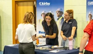 Representatives from Kirby meeting a DkIT student at the Careers Fair