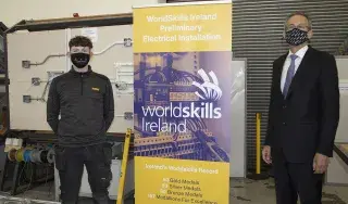 Electrical Installations Competition Winner Damien Flynn with DkIT President Michael Mulvey