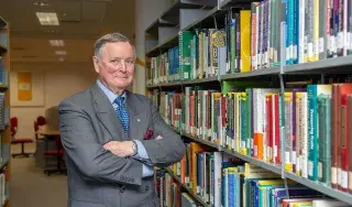 General John de Chastelain pictured in the newly named de Chastelain Library at DkIT