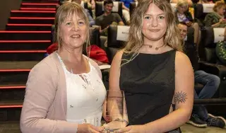 Wendy Baugh (Blackmagic Design) presenting a DkIT award to Jessica Doherty