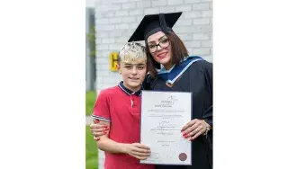 Sarah Murphy from Dundalk, Louth receives her BA (Honours) in Film and Television Production Award pictured with her son Louis at DkIT Graduation 2019.