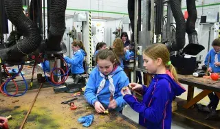 Guide in plumbing workshop connecting sections of pipe together