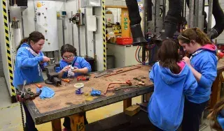 Guides in the ‘Practical Plumbing’ workshop that was facilitated by Simon O’Neill, Head of Section of Carpentry & Joinery and Plumbing. In this photo the girls fitted a new washer in a sink tap.