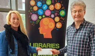 Wendy Rudd receiving her award from Peter Mac Kenna, Subject Librarian, DkIT School of Health