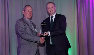 Neil McLoughlin, Technology Transfer Manager at DkIT (on left) receives award for 'Spin-Out Company of Year' at KTI Impact Awards 2019.