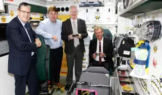 Staff from DkiT School of Informatics & Creative Arts inside Bumbleance Ambulance at national launch of Megadojo