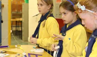 Members of Naomh Bhuite Brownies carrying out STEM Engineering challenges