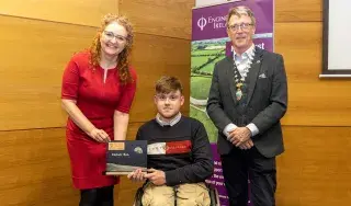 Dr Niamh Shaw presenting her award to Christopher Duffy with Pat McCormick , Chairperson of the Engineers Ireland Northeast Region