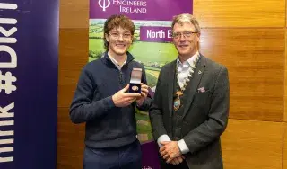 Kian O’Brien receiving The Peter Rice Medal from Pat McCormick , Chairperson of the Engineers Ireland Northeast Region