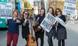 (L-R): Dr Ann-Marie Hanlon (DkIT), Joanne Cusack (Fair Plé), Sinéad Furlong (Mnásome), Rossella Bottone (Girls Rock Dublin) and Dr Laura Watson (Sounding the Feminists, Maynooth University) pictured on O’Connell St, Dublin to demand better representation for women in Ireland’s cultural history.