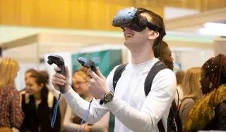 DkIT Student using Virtual Reality Headset at the DkIT Careers Fair 2018.