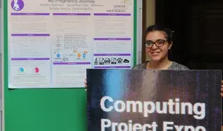 Pictured: Natasha McGivern, Final Year BSc Hons Computing in Cloud Computing student, pictured with a poster presentation of her Pregnancy App