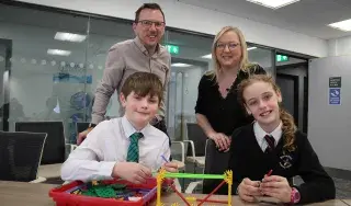 (Front) Aaron from Bangor Central Integrated Primary School and Victoria from Bloomfield Primary School test out the new All-Island Engineering resources developed by Engineering Lecturers (back) Gareth Kelly from Dundalk Institute of Technology (DkIT) and Aine McGreeghan South Eastern Regional College (SERC) and funded through The Community Foundation Ireland.