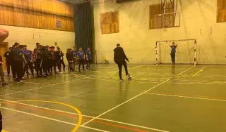 Students taking part in the penalty shootout organised by the class