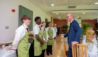 Simon Coveney with DkIT Hospitality Students