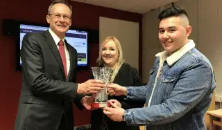 (L-R) DkIT President Michael Mulvey presenting the award to Dayna Branigan and Gareth Lau at a special awards reception at DkIT.