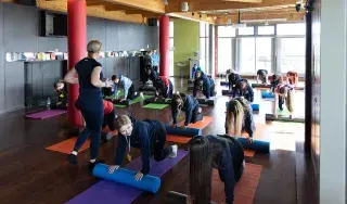 Students taking part in Pilates during the Ex-HER-cise event