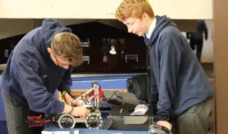 Dominik Bayer and Cillian Watterson from Dundalk Grammar School making some final touches to their robot. 