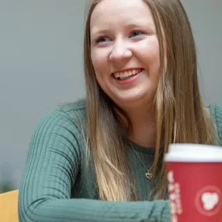 Student with Costa Coffee Cup